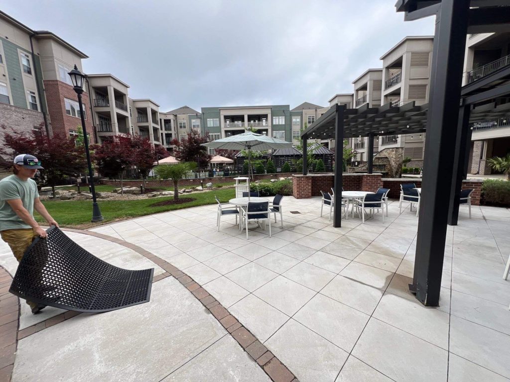 Apartment complex pressure washing company cleaning apartment exterior and pool deck in Charlotte NC