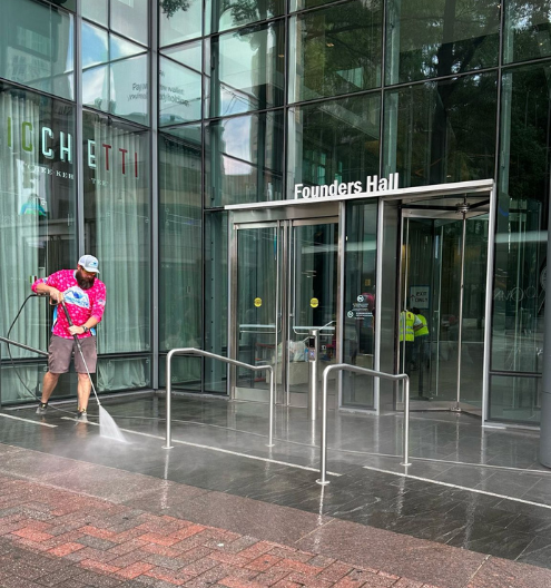 Commercial pressure washing company cleaning brick walkway - downtown Charlotte NC commercial pressure washing