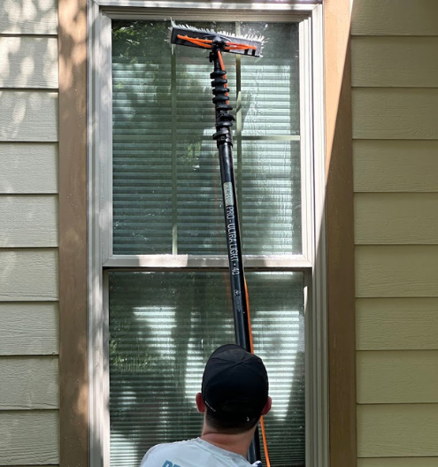 House pressure washing company soft washing home exterior and cleaning exterior windows in Charlotte NC