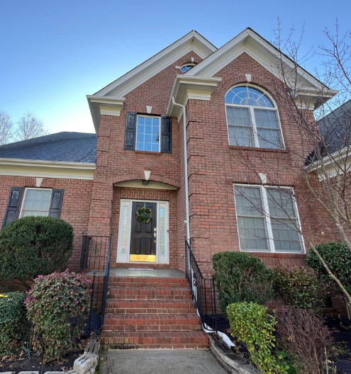 After photo of beautiful brick home's clean exterior by Charlotte Exterior Services