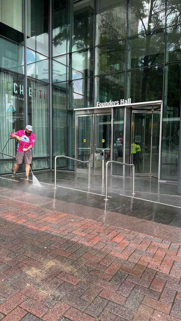 Commercial pressure washing company cleaning brick walkway - downtown Charlotte NC commercial pressure washing