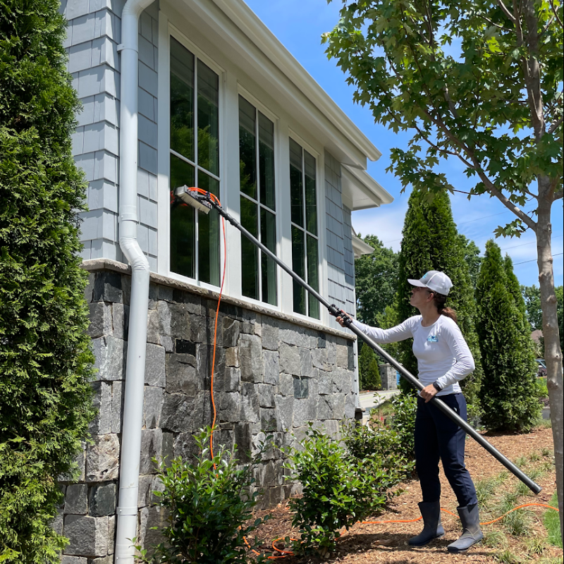 House pressure washing company soft washing home exterior and cleaning exterior windows in Charlotte NC