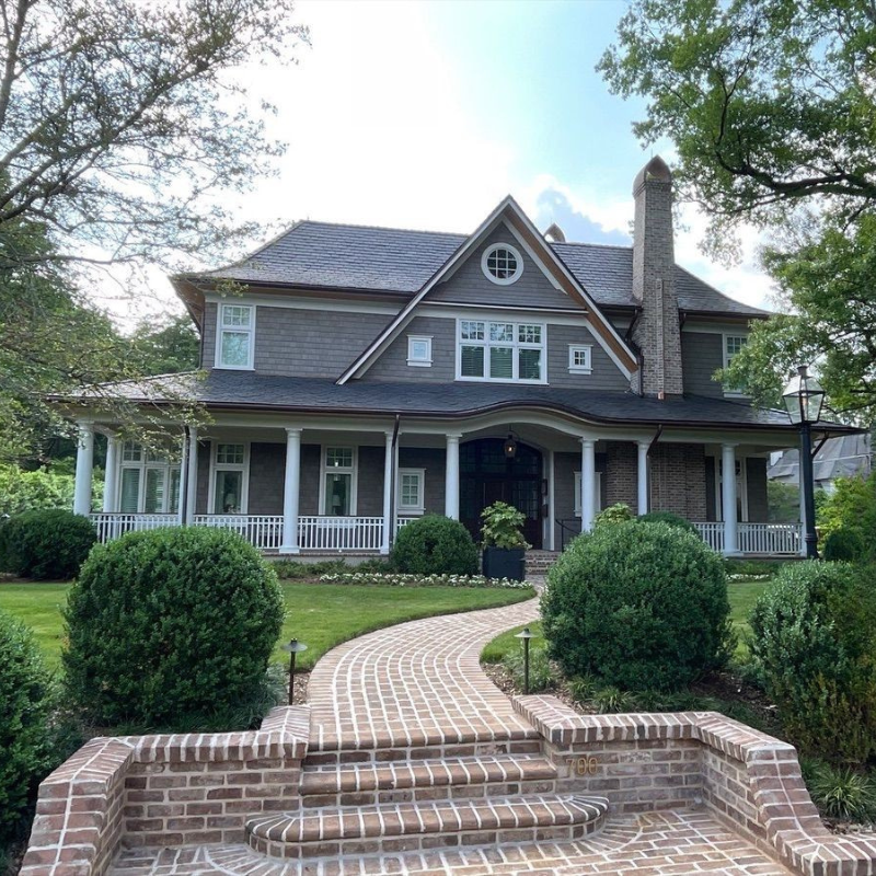 After photo of beautiful luxury home's clean roofing and facade. Slate shingled home cleaned by luxury home pressure washers Charlotte Exterior Services in Charlotte NC