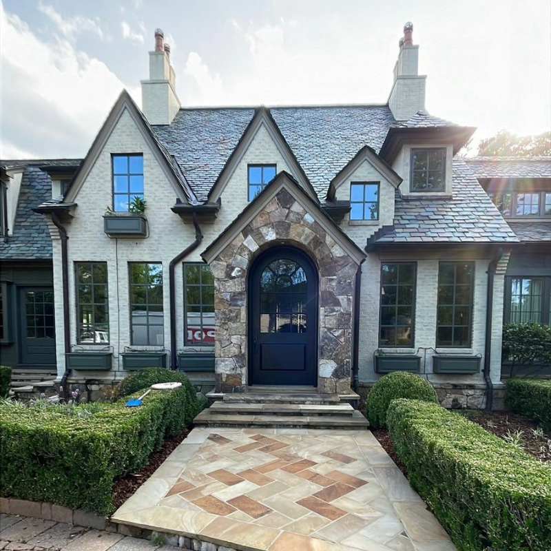 After photo of luxury home's clean roof and soft washed painted brick siding done by Charlotte Exterior Services in Charlotte NC
